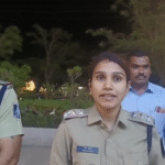 Rajendra Nagar Police officers interacting with children and parents inside Kalyan Mart during a child safety awareness campaign, documentary-style presentation.