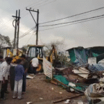 Revenue officials, municipal corporation team and police personnel conducting encroachment removal action in Bank Gram, Malharganj, with government land clearance visuals.