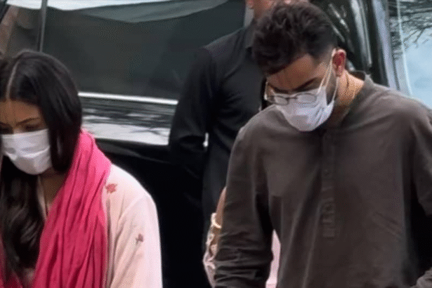 Virat Kohli and Anushka Sharma walking in Vrindavan near Keli Kunj Ashram with devotional atmosphere, temple architecture and spiritual surroundings.