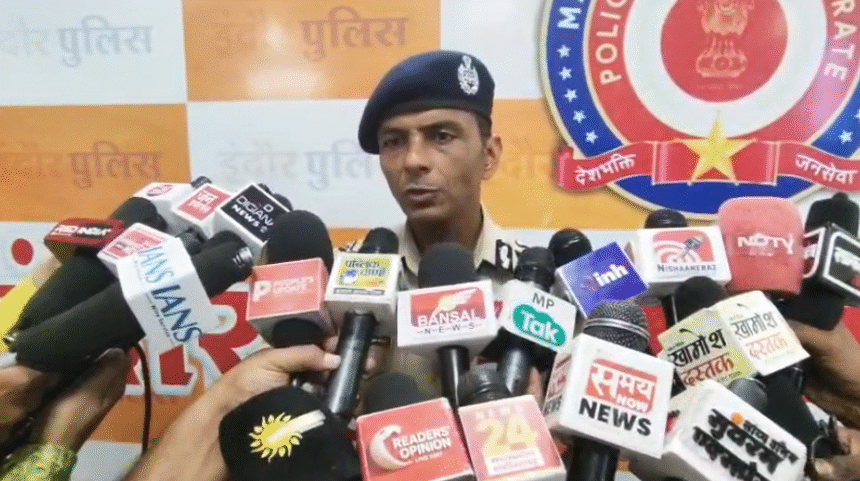 Police Commissioner Santosh Kumar Singh with Indore city map highlighting Lasudia, Banganga-Super Corridor and Dhar Road proposed police station zones.