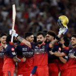 Virat Kohli holding the IPL trophy with RCB players celebrating at Narendra Modi Stadium, confetti in the background and championship moment focus.